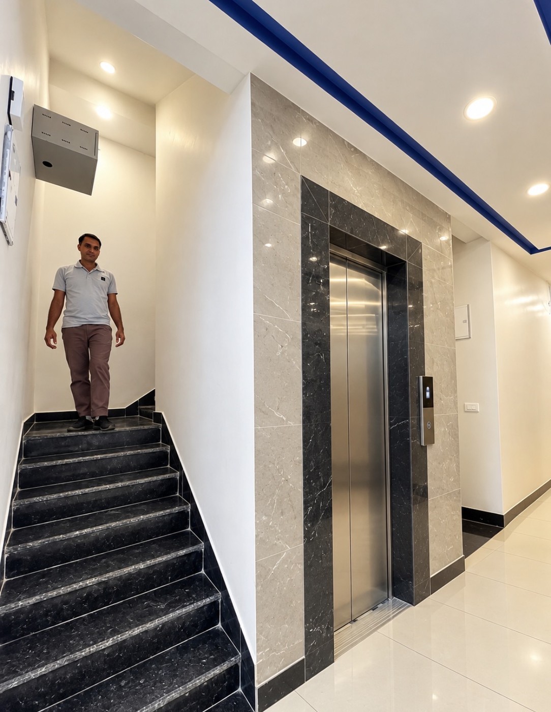 Quiet guest floor hallway with secure room door locks and ambient light
