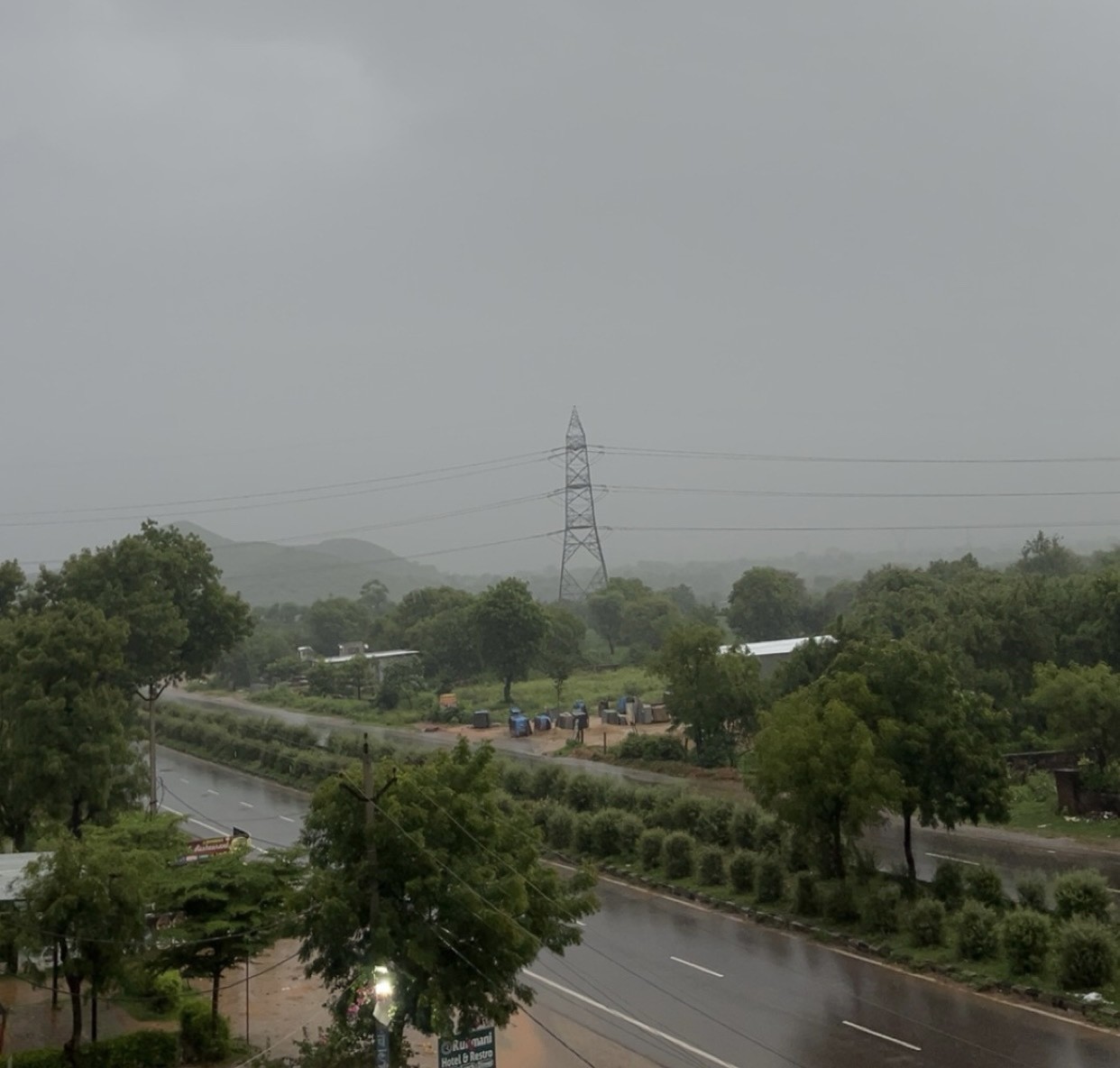 Misty monsoon view of Jaipur-Delhi Highway and rolling hills from hotel